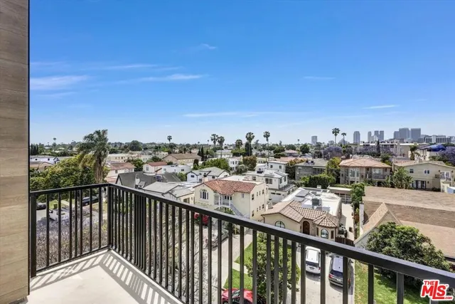 a view of a balcony with city view