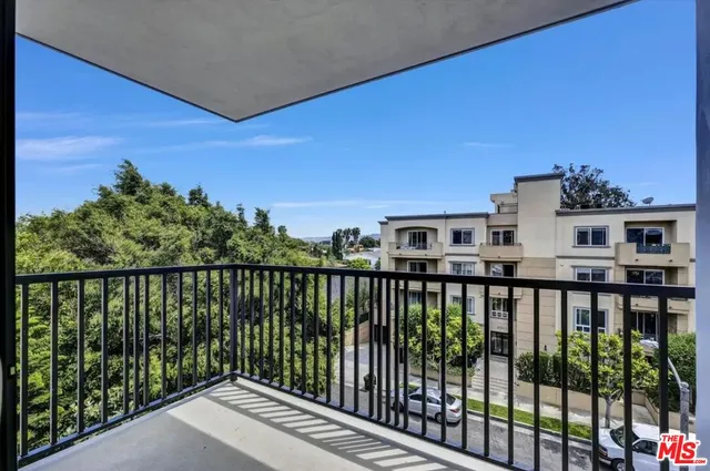 a view of a balcony with city view