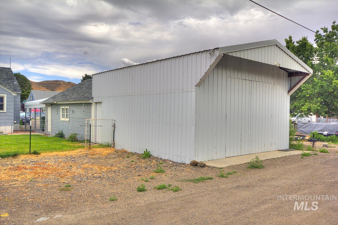 351 West Main Street South Vale, OR 97918 - Photo 28 of 33 Corrugated metal outbuilding with a peaked roofline and concrete foundation. Shop features 220v