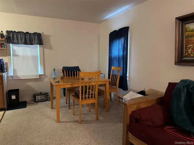 a view of a livingroom with furniture and breakfast area