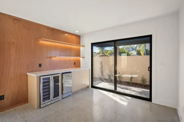a view of kitchen with a sink and a large window