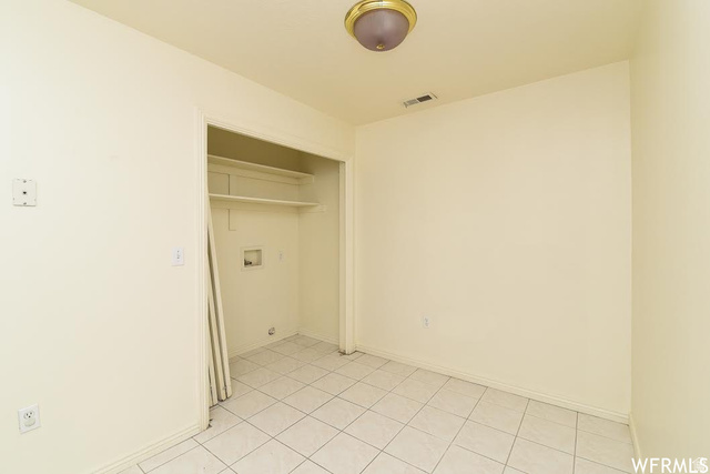 1130 North 200 West Bountiful, UT 84010 - Photo 10 of 11 Laundry area with light tile patterned floors and baseboards