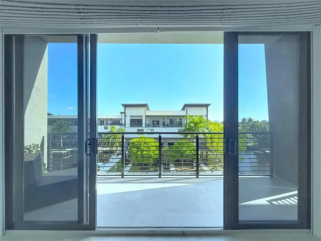 a view of a door and a window