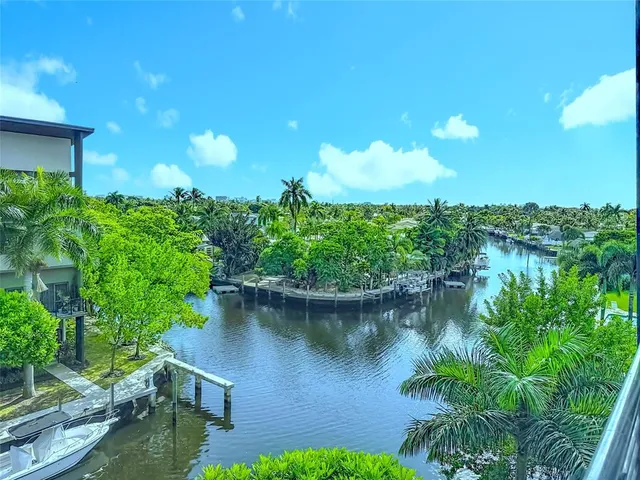 a view of a lake with a yard