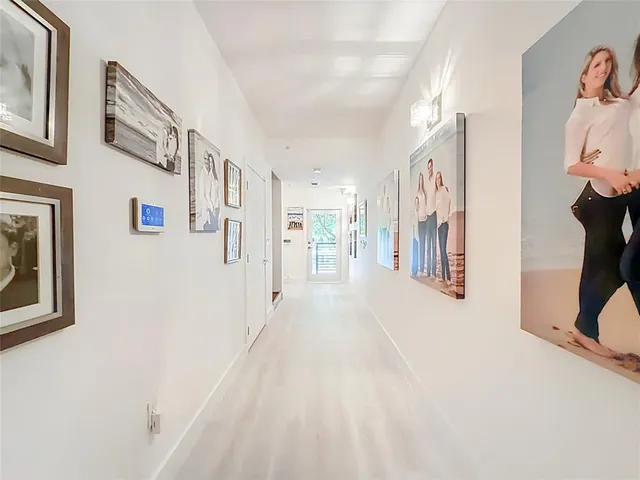a view of a hallway with a white walls