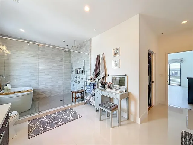 a bathroom with a toilet a sink and a mirror