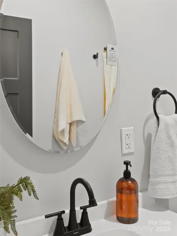 a bathroom with a toilet sink vanity tub and shower