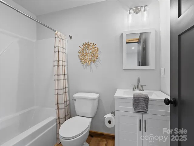 a bathroom with a shower and a shower