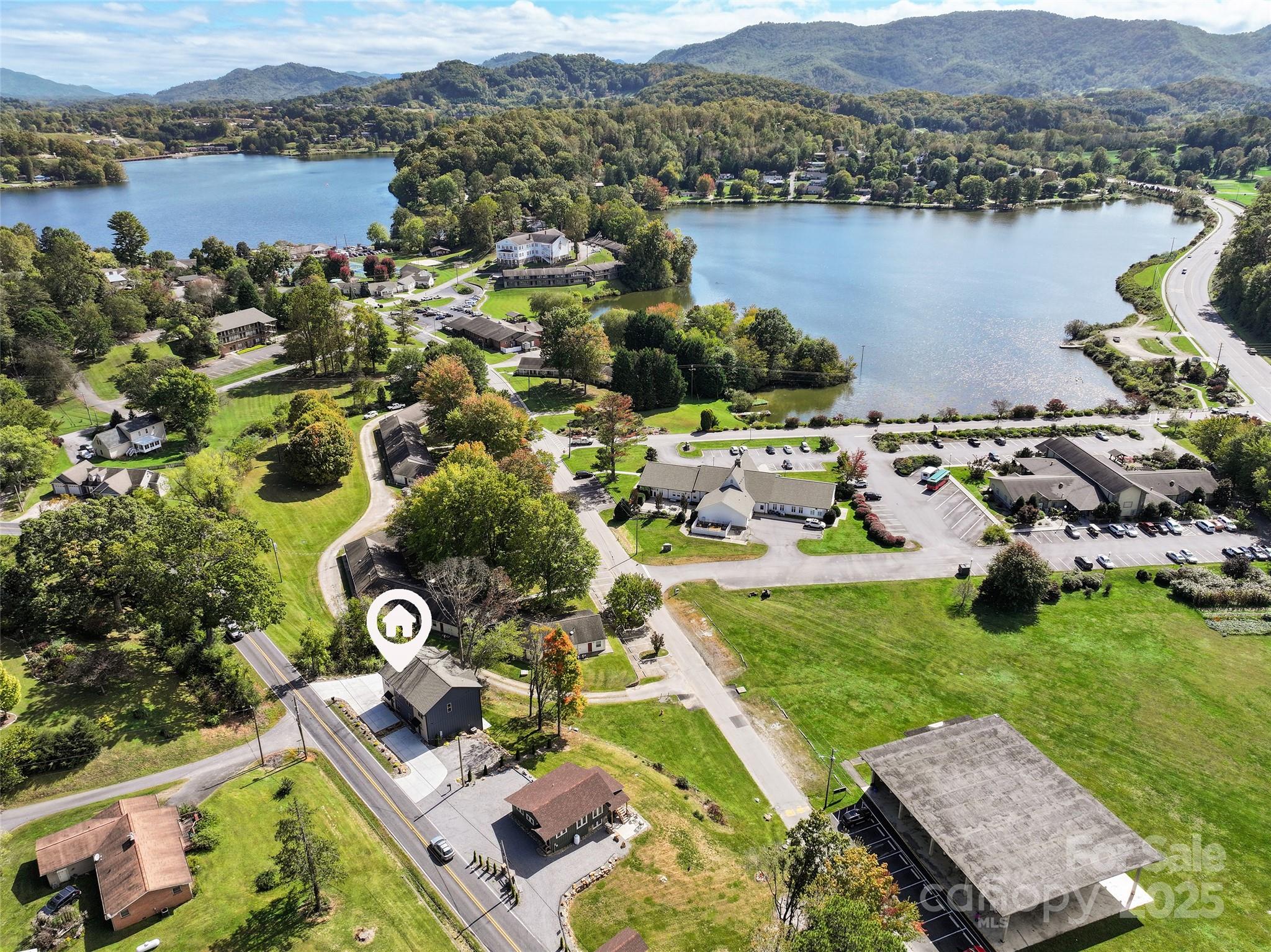 292 County Road Waynesville, NC 28785 - Photo 3 of 26 an aerial view of a house with a lake view