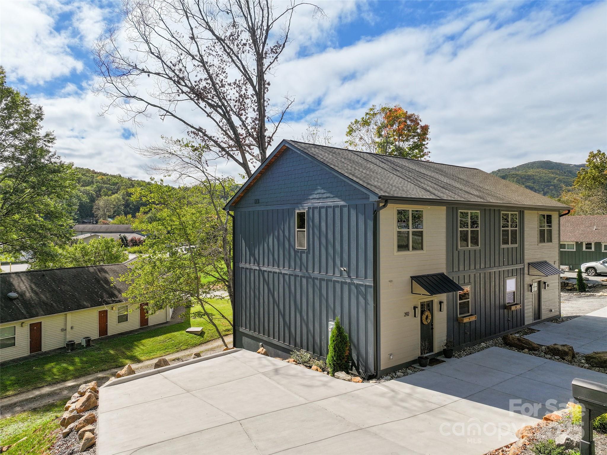 292 County Road Waynesville, NC 28785 - Photo 6 of 26 a front view of a house with a garden