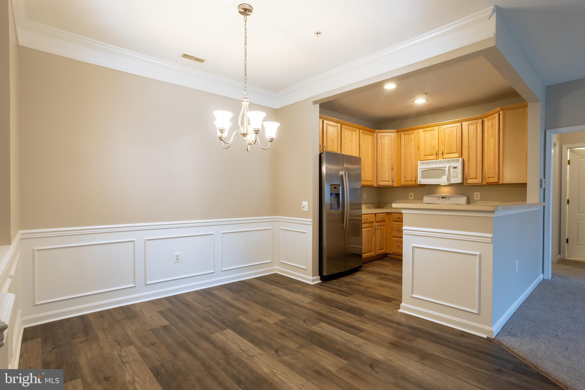 504 Lloyd Place Bel Air, MD 21014 - Photo 13 of 40 a view of a kitchen with a sink a refrigerator and window