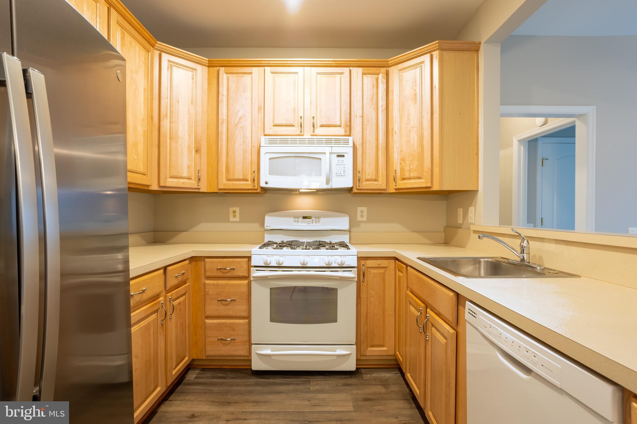 504 Lloyd Place Bel Air, MD 21014 - Photo 14 of 40 a kitchen with a stove white cabinets and sink