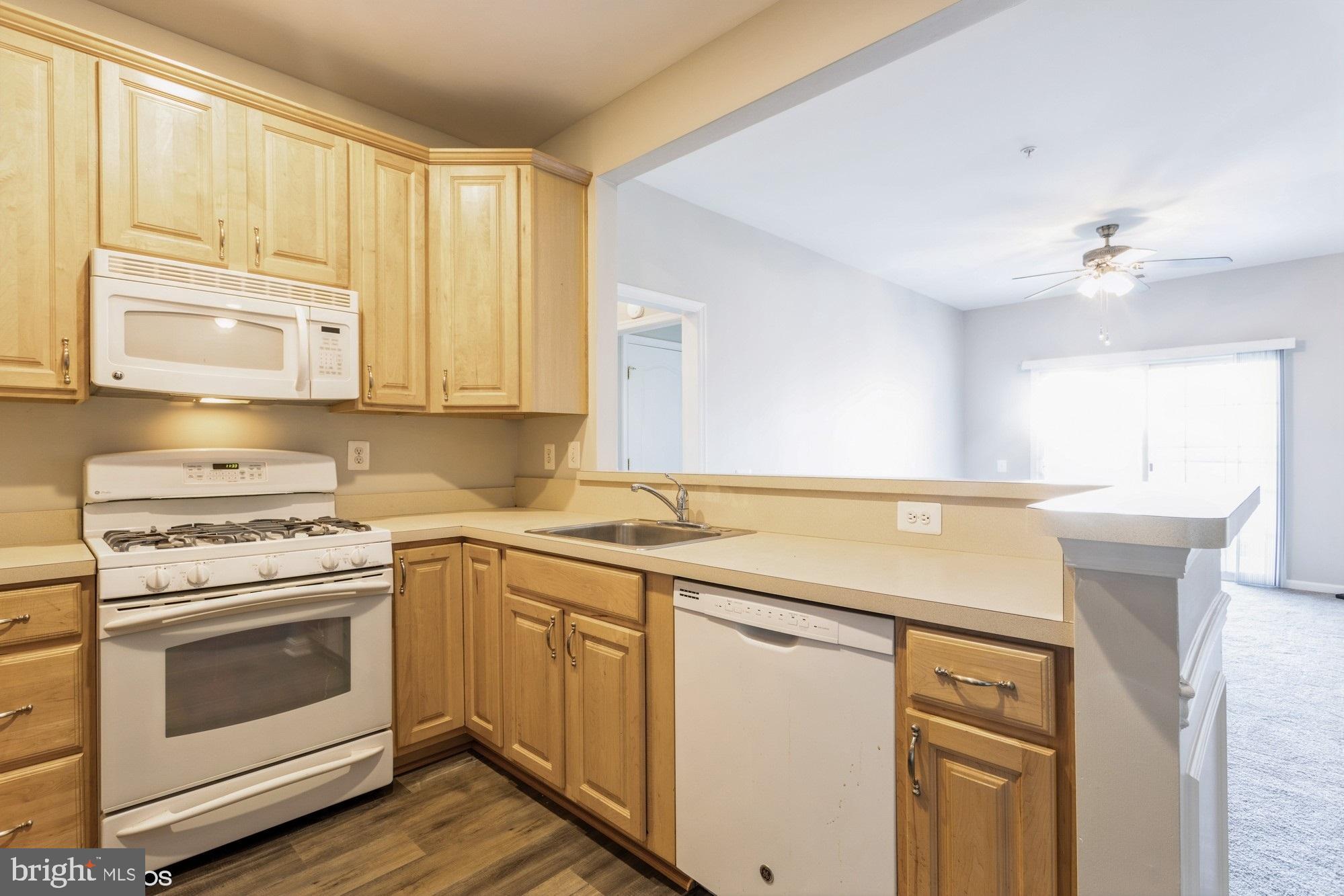 504 Lloyd Place Bel Air, MD 21014 - Photo 16 of 40 a kitchen with a stove sink and cabinets