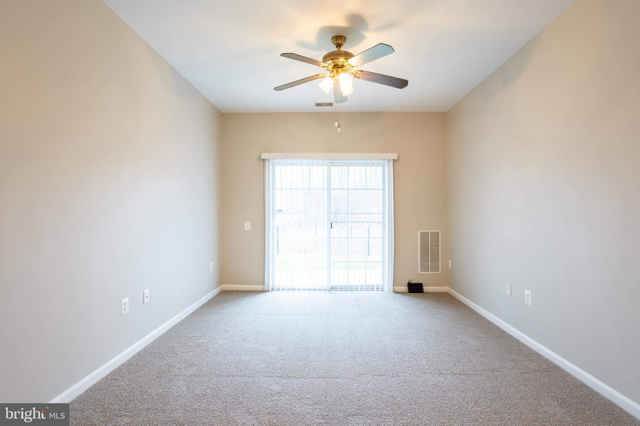 504 Lloyd Place Bel Air, MD 21014 - Photo 19 of 40 an empty room with chandelier fan and windows