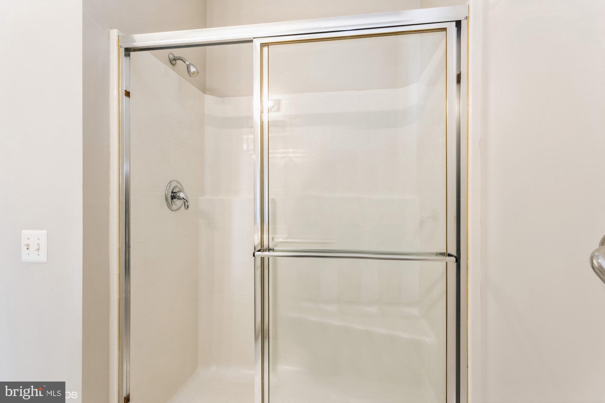 504 Lloyd Place Bel Air, MD 21014 - Photo 27 of 40 a bathroom with a glass shower door