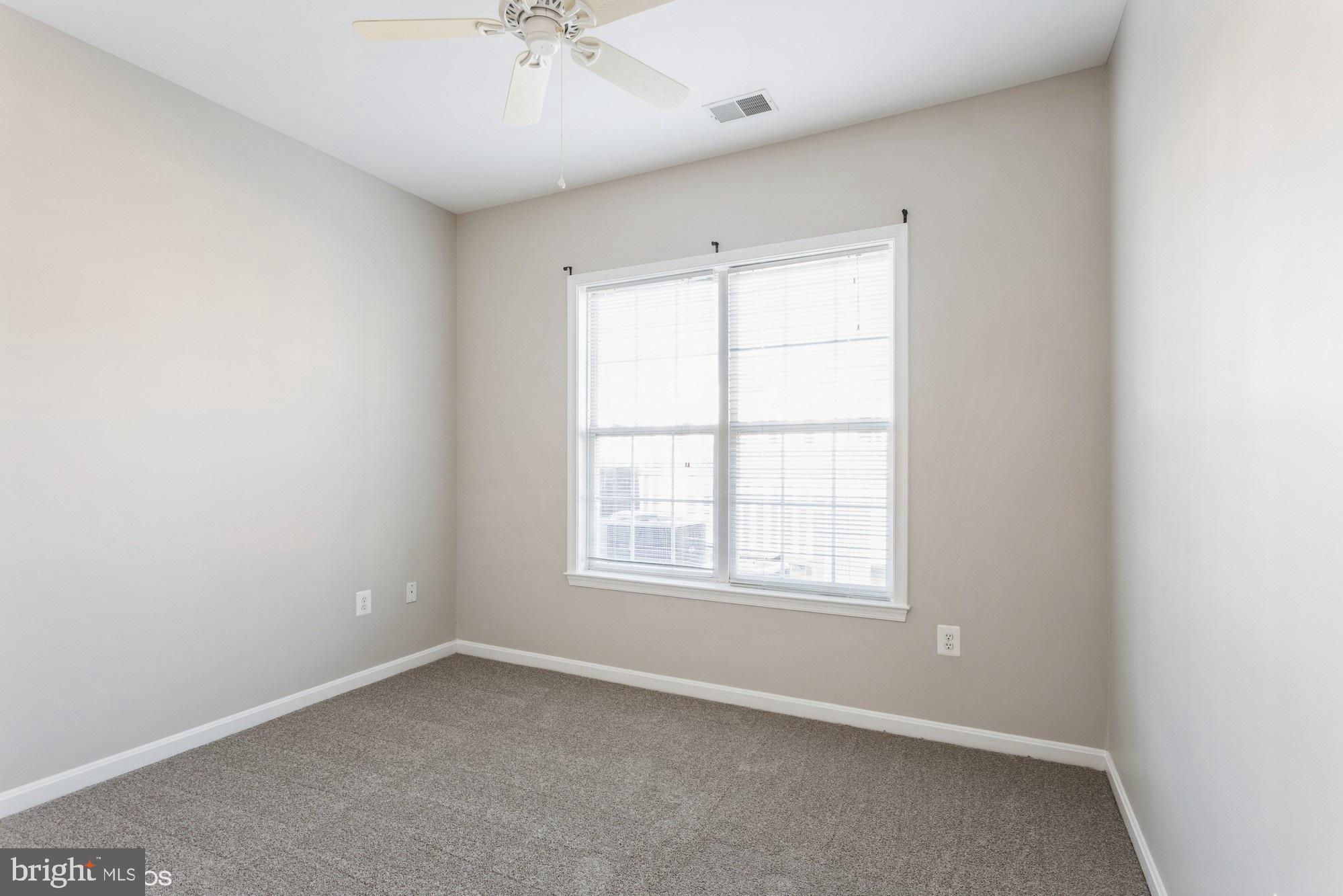 504 Lloyd Place Bel Air, MD 21014 - Photo 29 of 40 an empty room with a window and a fan