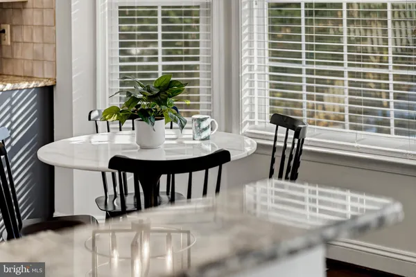a view of a dining room with furniture and window