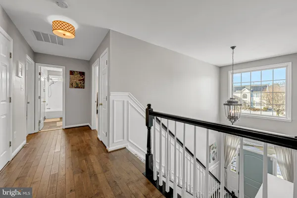 a view of an entryway with wooden floor