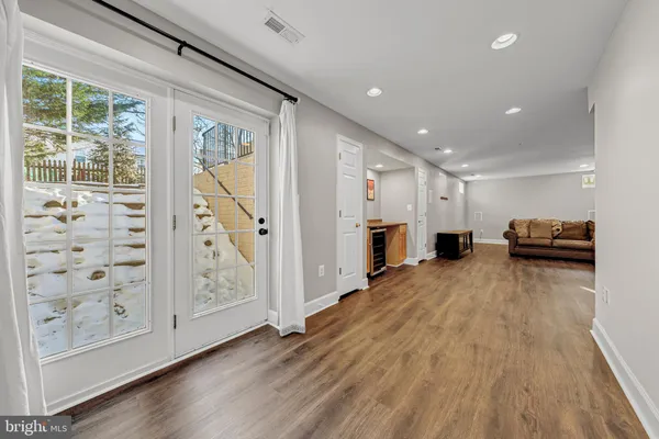a view of kitchen with furniture and wooden floor