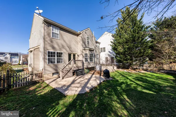 a view of backyard with sitting area