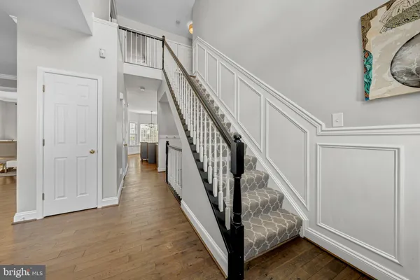a view of staircase with wooden floor and stairs