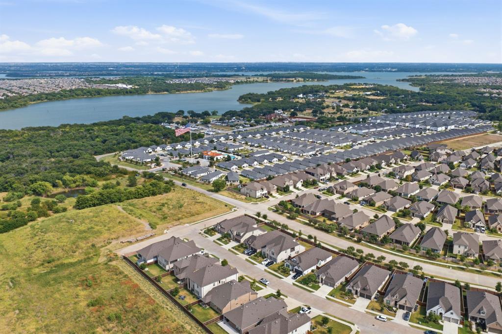 709 Bent Brook Road Oak Point, TX 75068 - Photo 17 of 20 Expansive aerial capturing a residential community with a large body of water in the background