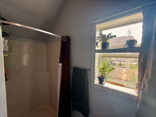 a view of walk in closet with a window