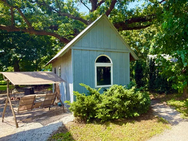 a view of house with garden