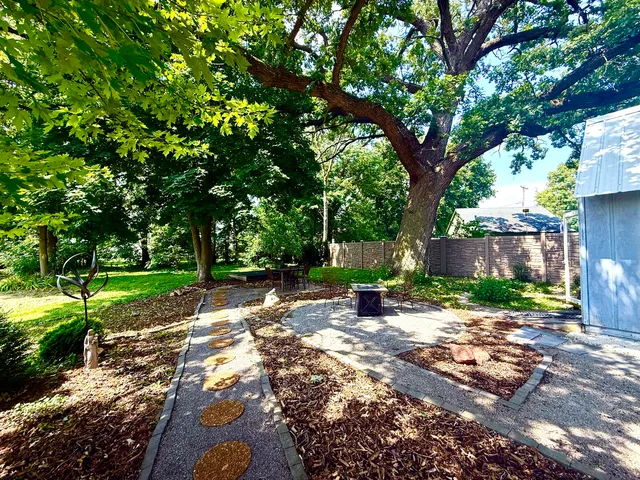 a backyard of a house with lots of green space
