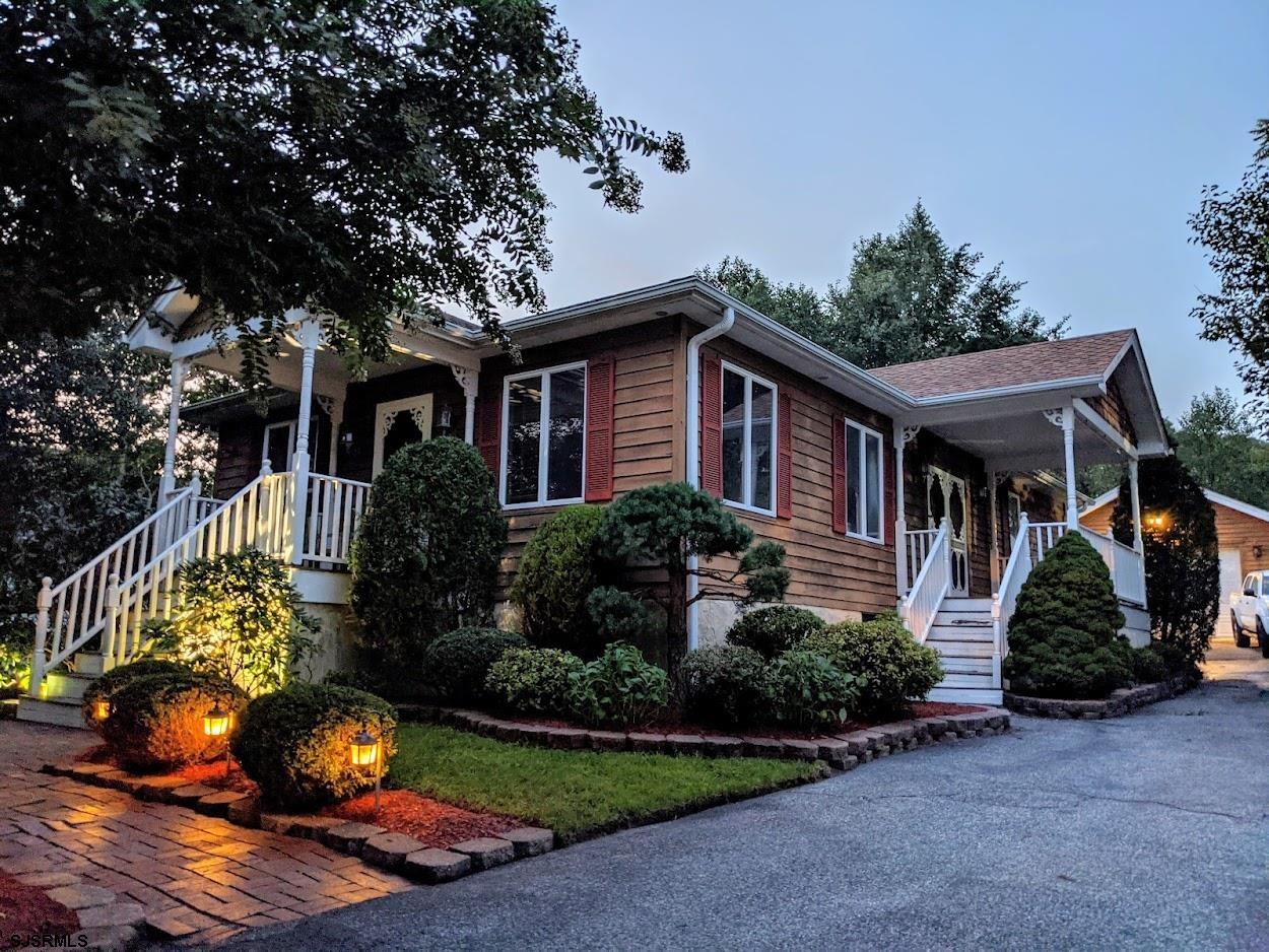 6 Stone Circle Absecon, NJ 08201 - Photo 1 of 39 a front view of a house with a yard and potted plants