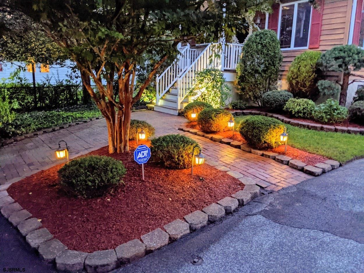 6 Stone Circle Absecon, NJ 08201 - Photo 2 of 39 a view of a yard with plants and large trees