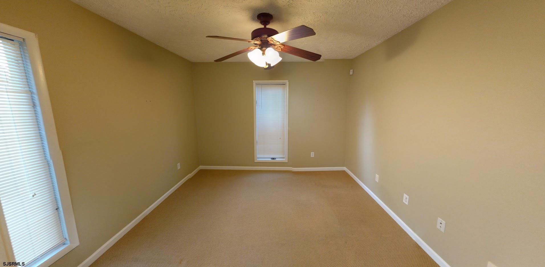 6 Stone Circle Absecon, NJ 08201 - Photo 19 of 39 a view of an empty room and a chandelier fan
