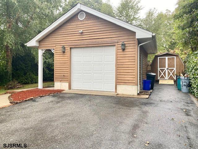 6 Stone Circle Absecon, NJ 08201 - Photo 28 of 39 a view of a house with a yard and garage
