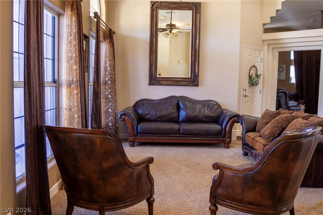 2775 Taylor Street Logandale, NV 89021 - Photo 11 of 41 This inviting living room features ample natural light and a comfortable atmosphere for gatherings.
