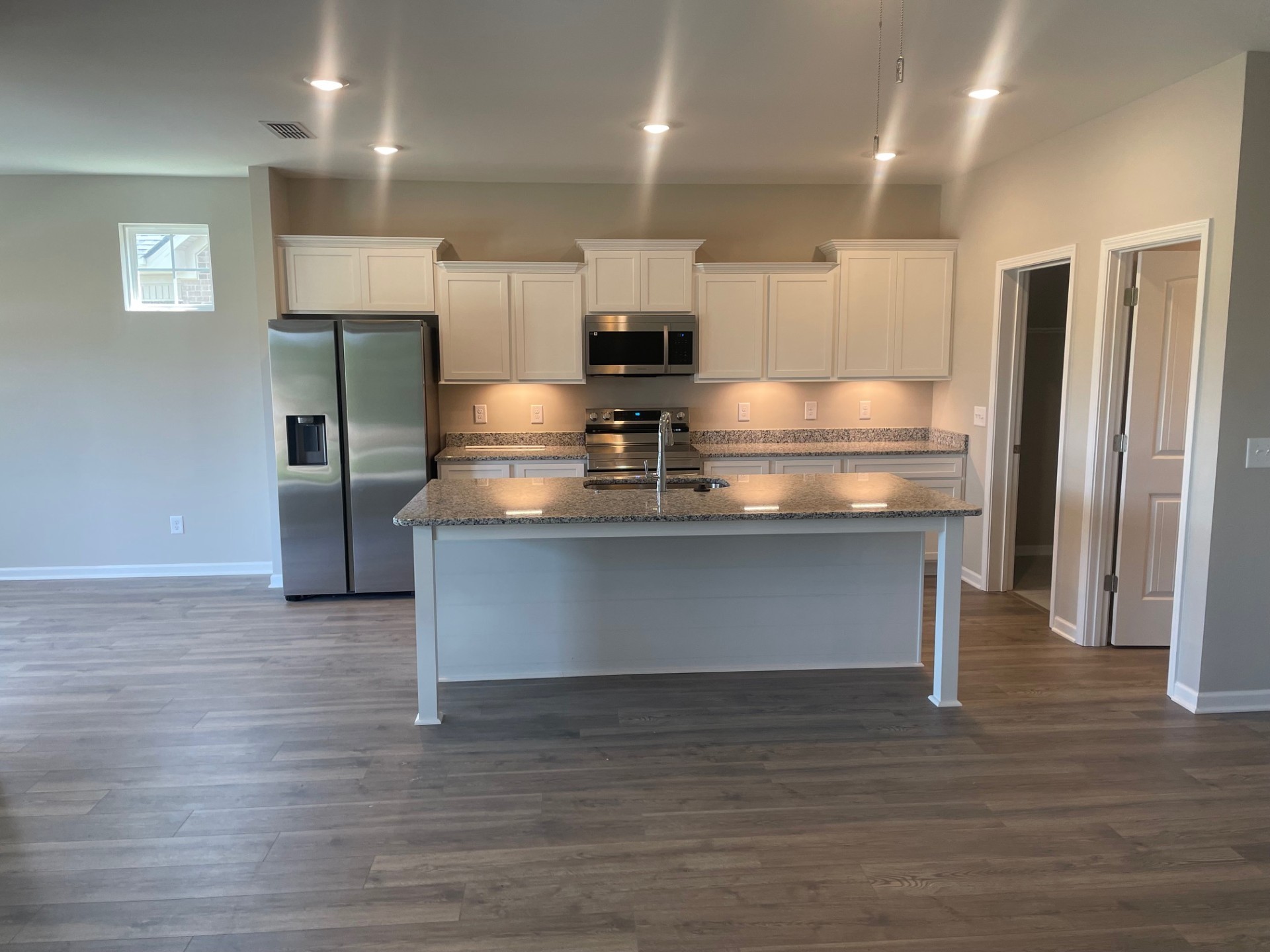 414 Wren Way Spring Hill, TN 37174 - Photo 4 of 12 a view of kitchen with stainless steel appliances granite countertop a stove and a refrigerator
