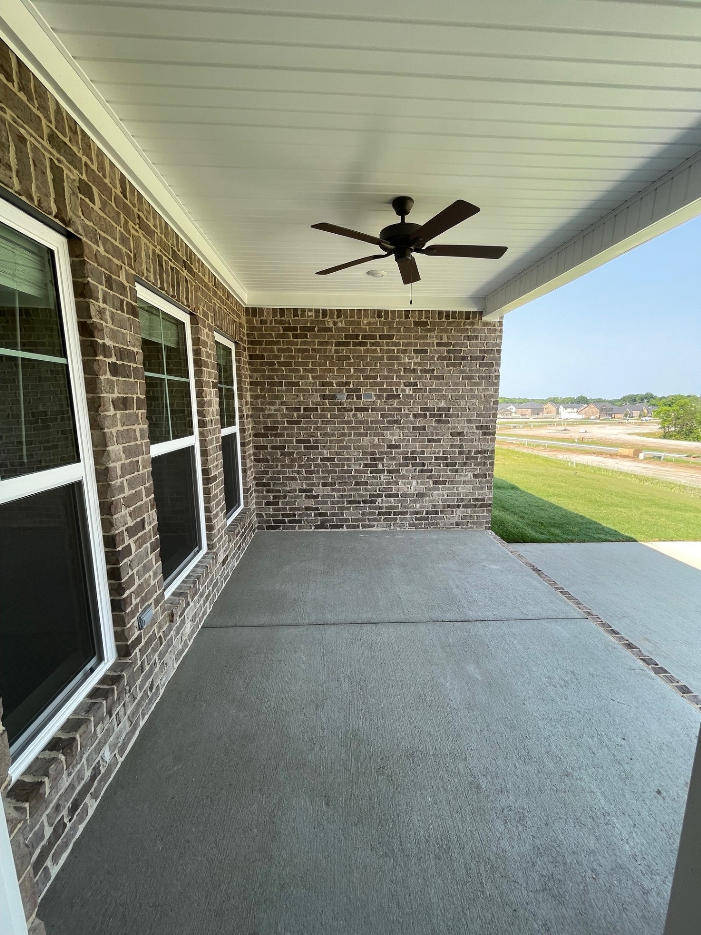 414 Wren Way Spring Hill, TN 37174 - Photo 7 of 12 a view of an empty room with a fireplace and a window