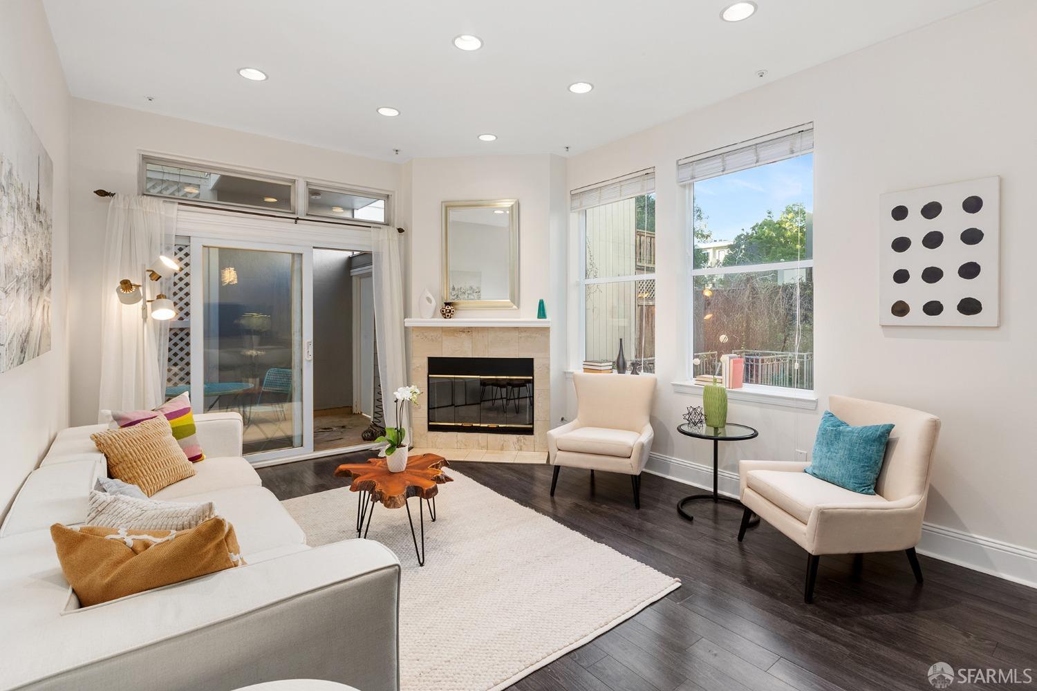1800 Turk Street, Unit 103 San Francisco, CA 94115 - Photo 1 of 42 a living room with furniture and a fireplace