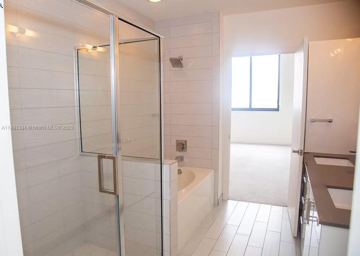 Brickell Miami, FL 33130 - Photo 12 of 20 a bathroom with a glass shower door