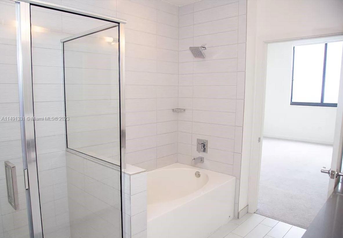 Brickell Miami, FL 33130 - Photo 13 of 20 a bathroom with a shower and a bathtub