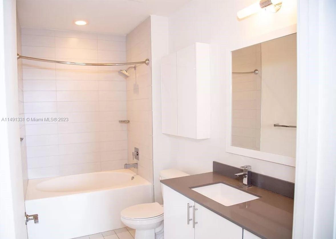 Brickell Miami, FL 33130 - Photo 14 of 20 a bathroom with a sink a toilet and a bathtub