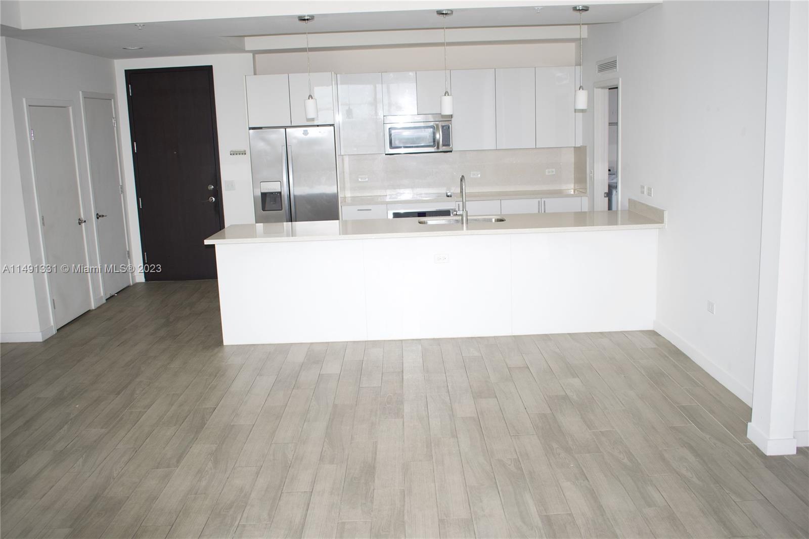 Brickell Miami, FL 33130 - Photo 17 of 20 a view of kitchen with wooden floor