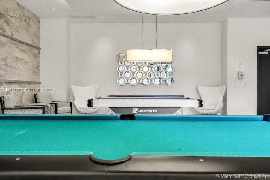 Brickell Miami, FL 33130 - Photo 6 of 20 a room with a table and a fireplace