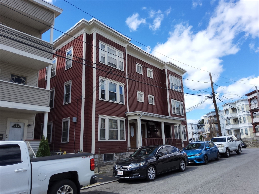 116 Bennington Street Lawrence, MA 01841 - Photo 3 of 14 a car parked in front of a building