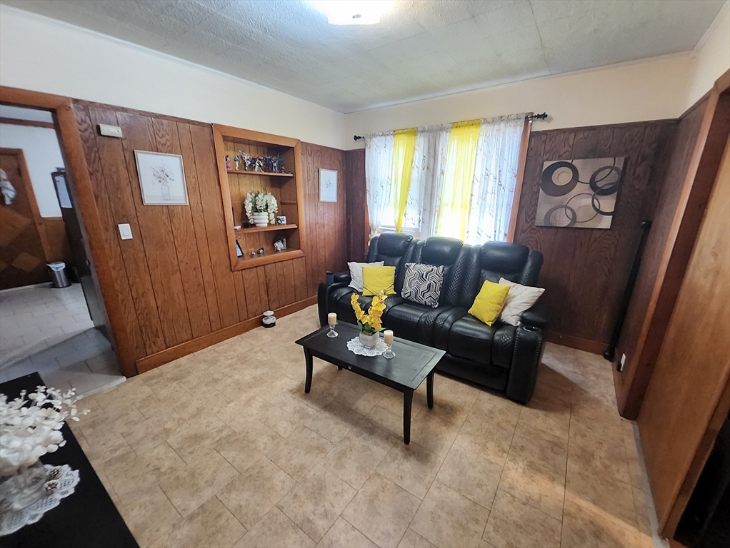 116 Bennington Street Lawrence, MA 01841 - Photo 5 of 14 a living room with furniture and a window