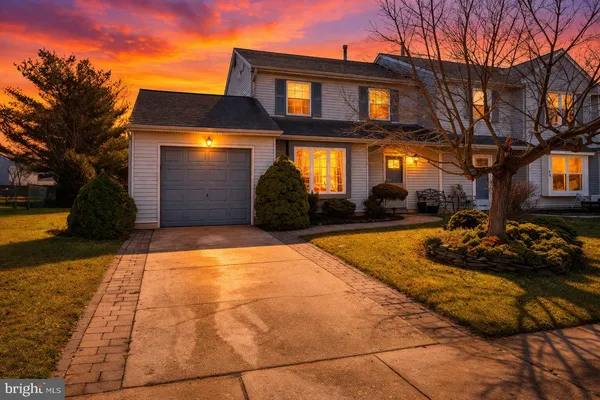 a view of a building with a yard