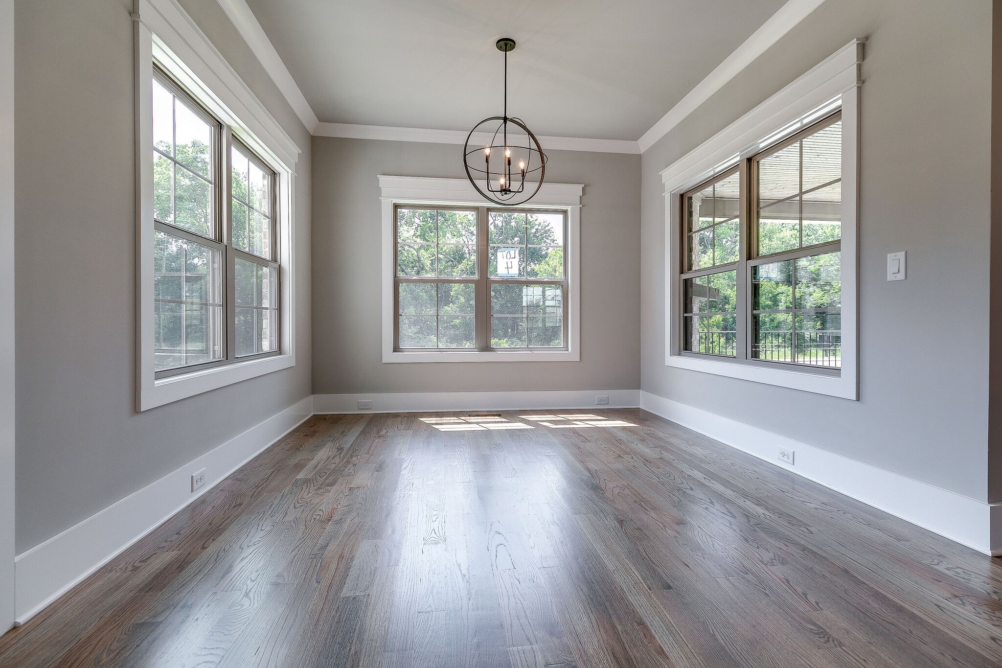 108 Arkstone Ln Spring Hill Spring Hill, TN 37174 - Photo 11 of 37 a view of an empty room with wooden floor and a window