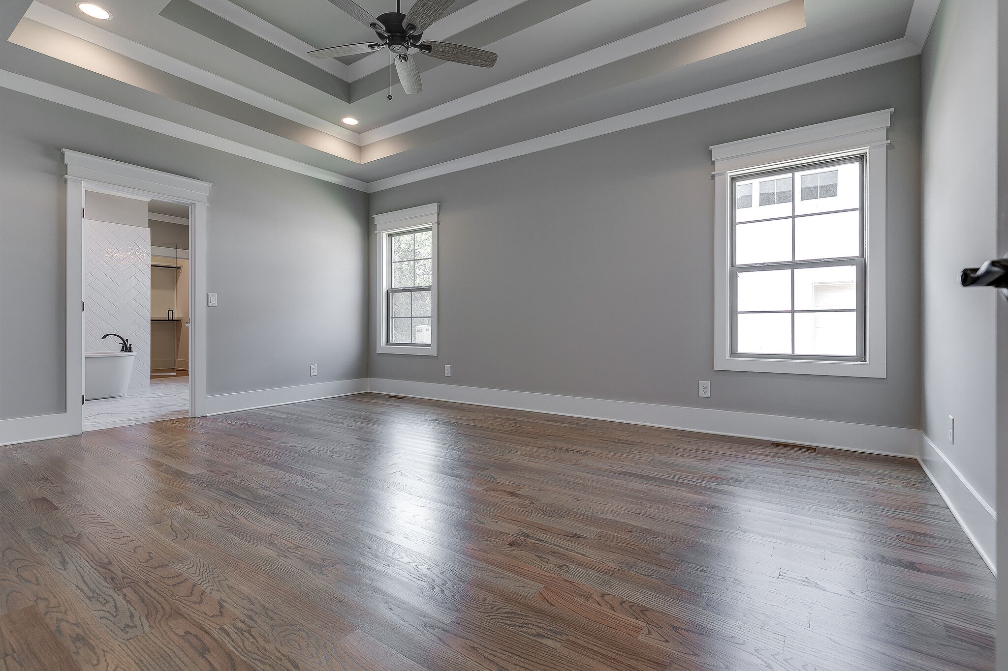 108 Arkstone Ln Spring Hill Spring Hill, TN 37174 - Photo 22 of 37 an empty room with wooden floor chandelier fan and windows