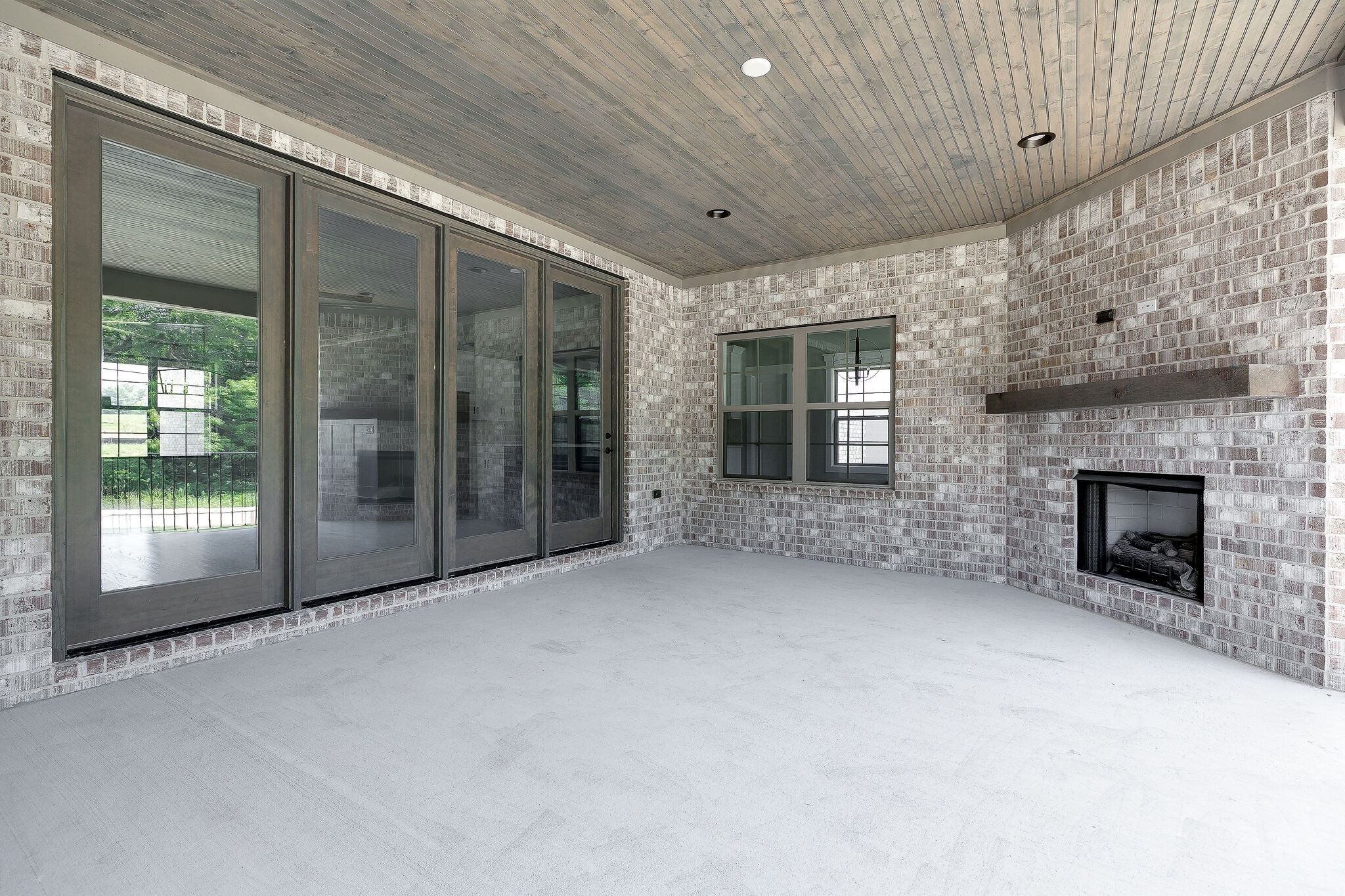 108 Arkstone Ln Spring Hill Spring Hill, TN 37174 - Photo 31 of 37 a view of empty room with floor to ceiling window and fireplace