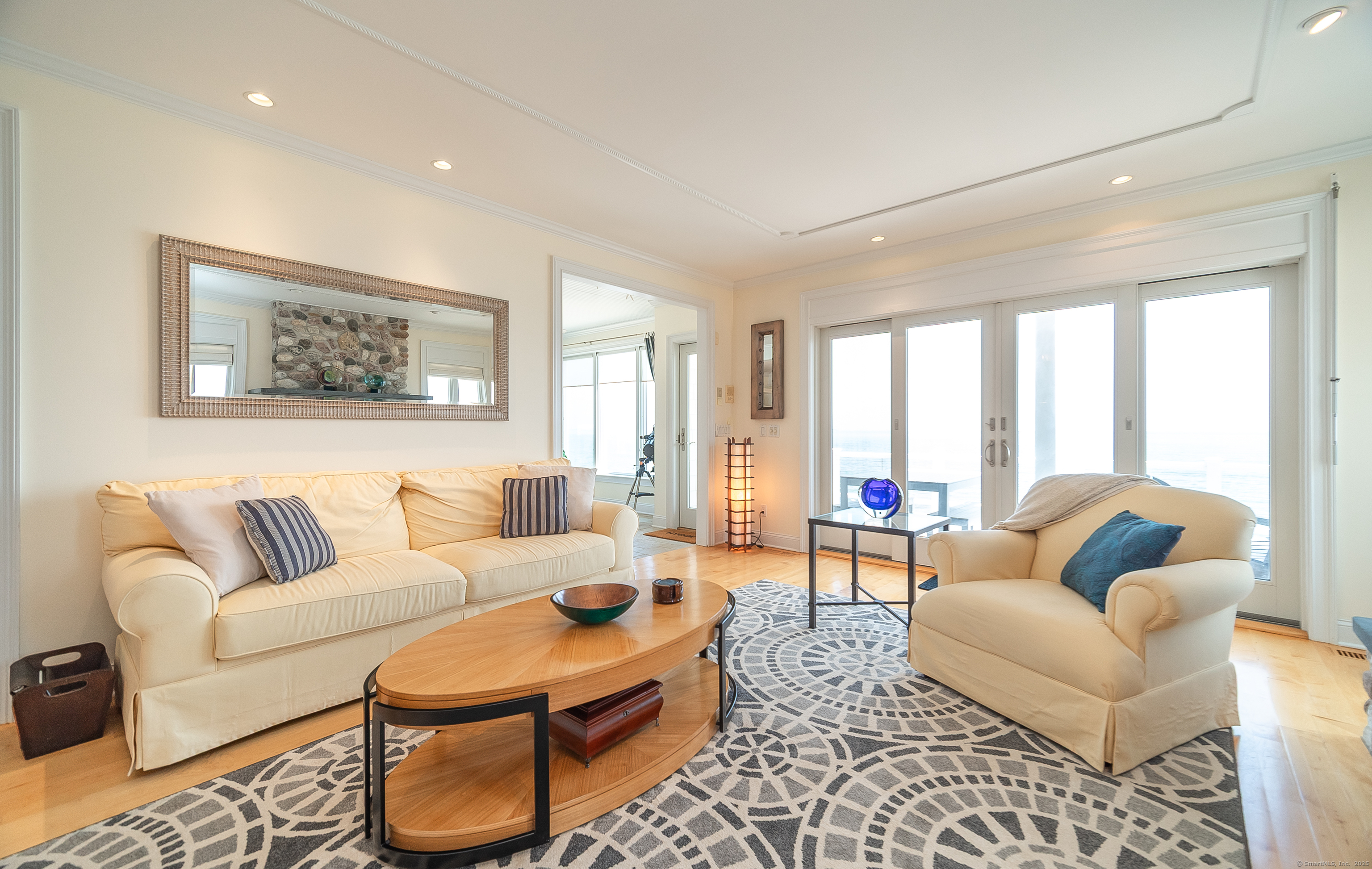 167 Shore Road Clinton, CT 06413 - Photo 11 of 40 Spacious living room with sliding doors to the deck overlooking the water.