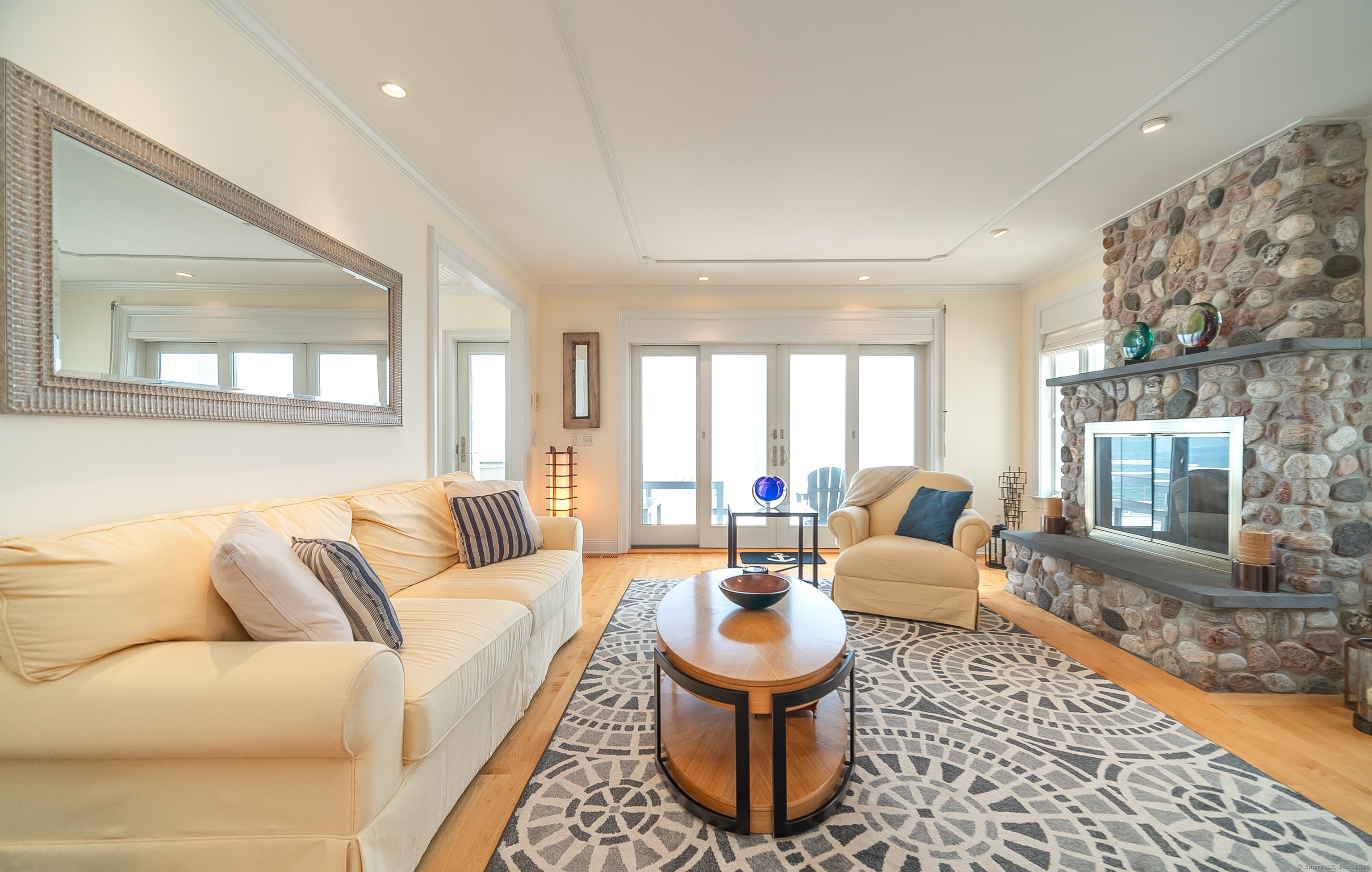 167 Shore Road Clinton, CT 06413 - Photo 12 of 40 Living room has a fireplace - can be propane or wood burning.